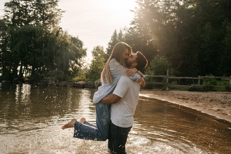 couple in all white walk into wedding reception