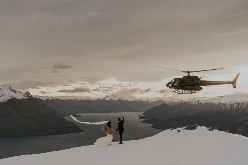 Amy & Nick posing on snowy mountain