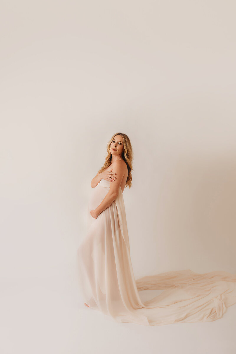Pregnant mother poses for Maternity Photos in Charleston.