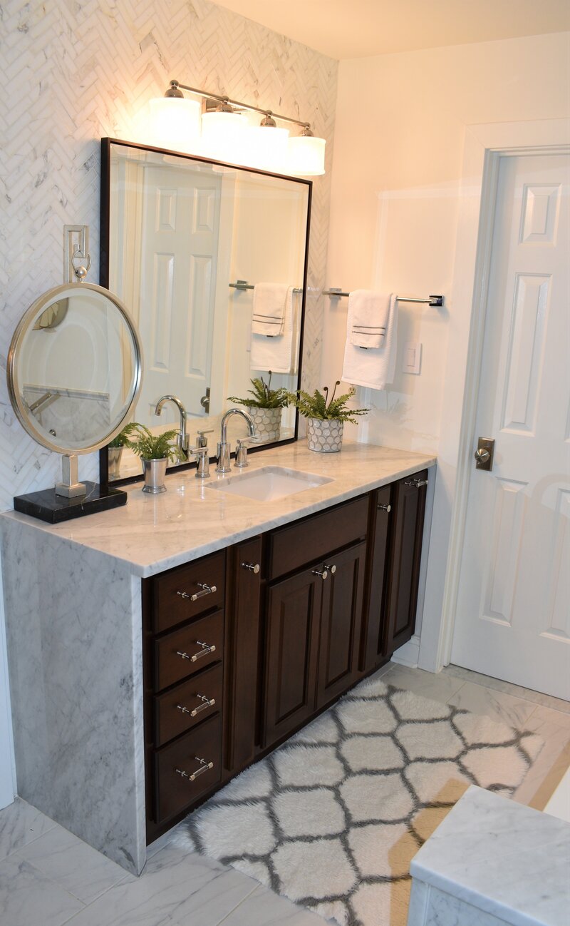 Dark cabinets and light countertops bathroom