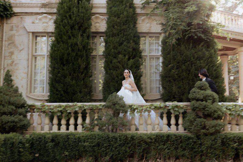 bride poses in dress at la caille wedding venue
