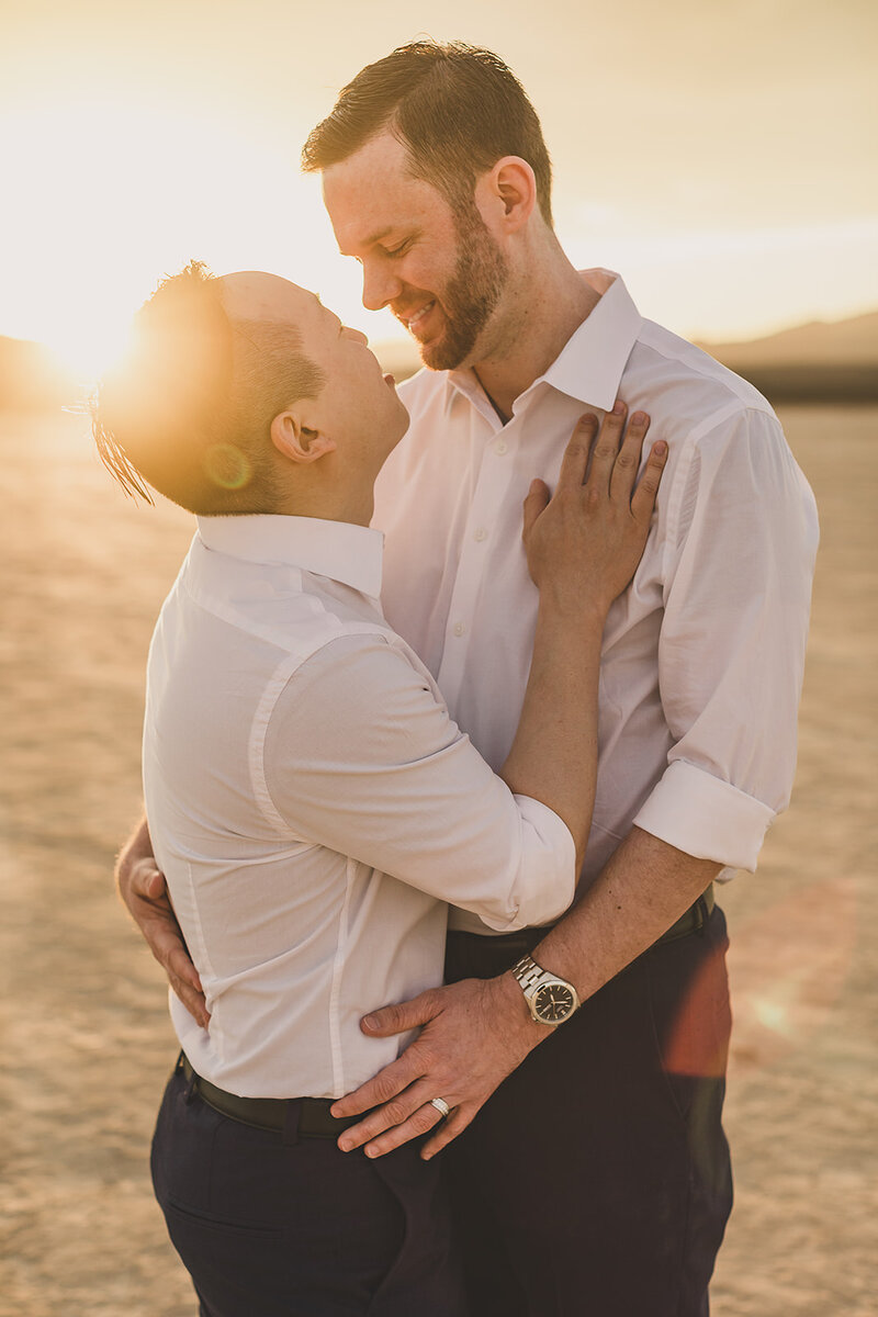 LGBTQ+ couple embraces after desert elopement ceremony in las vegas