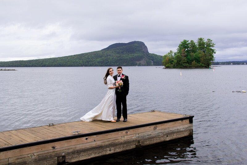 Couple standing together on dock | Wedding Photography