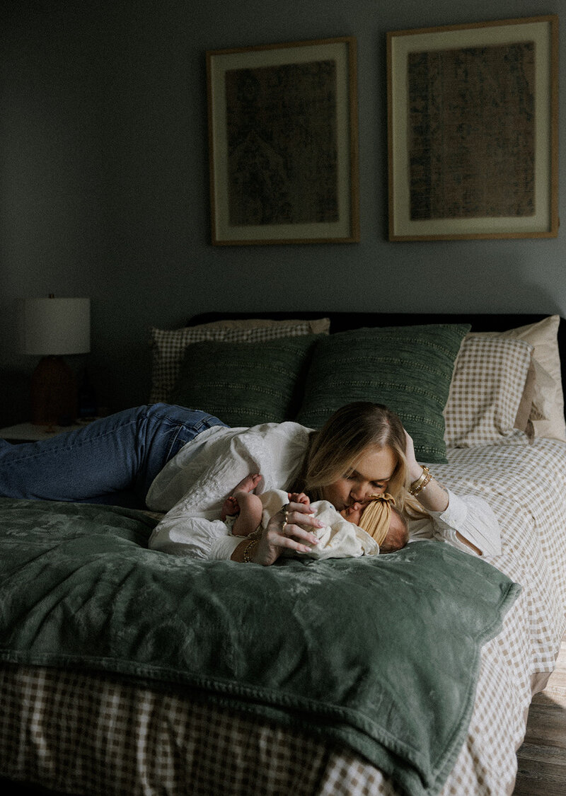 Expecting couple standing along the fence looking at each other