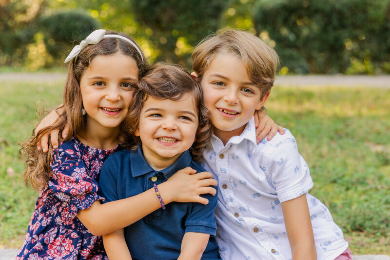 Siblings hugging in Atlanta park