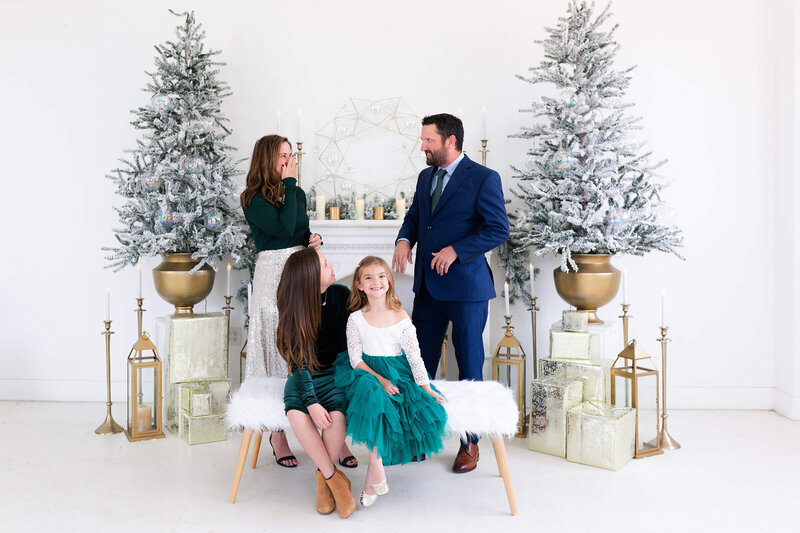 mom laughs in Christmas photo in Houston Texas by family photographer Swish and Click Photography