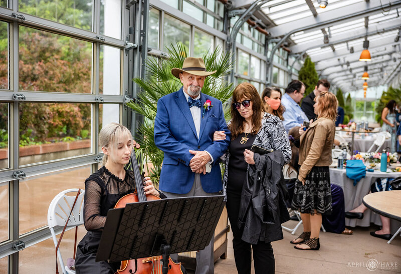Cellist plays a wedding reception at the Orangery at Denver Botanic Gardens