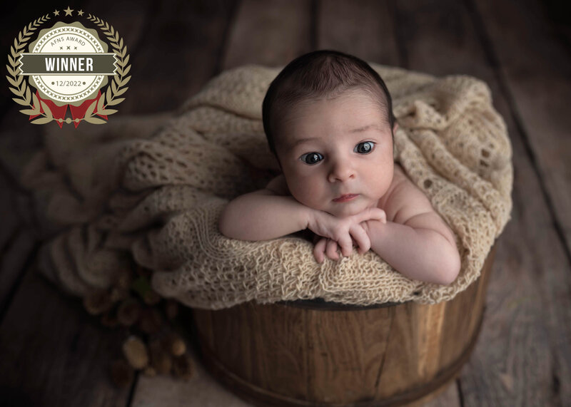 Denise a Paris, Ontario newborn baby photographer has won a newborn image competition with her image named Wide Eyes