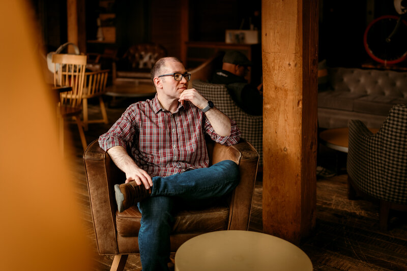 Natural lifestyle dating photos showing Ryan at a restaurant, capturing warmth and personality
