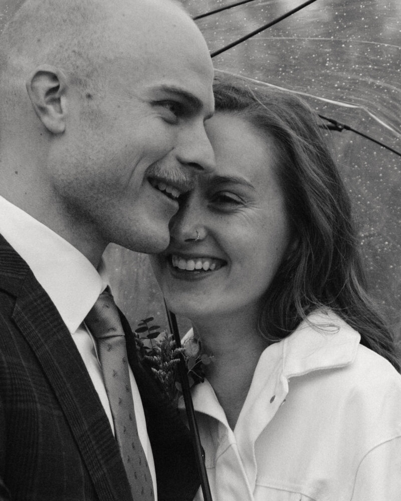 Toddler running and laughing with mother’s arms following close, photographed naturally in a garden setting in Columbia, Missouri, capturing real connection and joy.