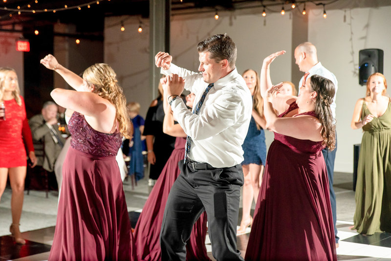 Wedding goers dance at a reception at SKY Armory in Syracuse