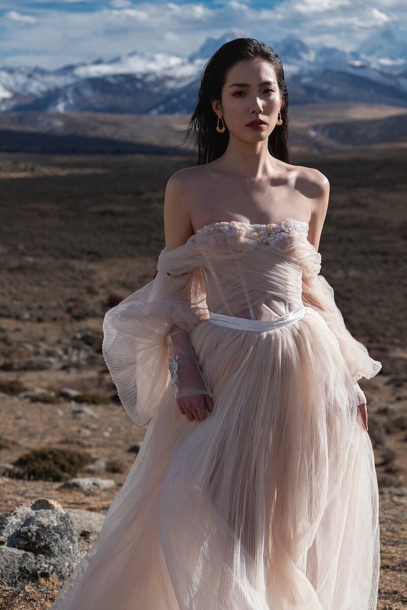 Couture bride shot in dramatic mountain scape.