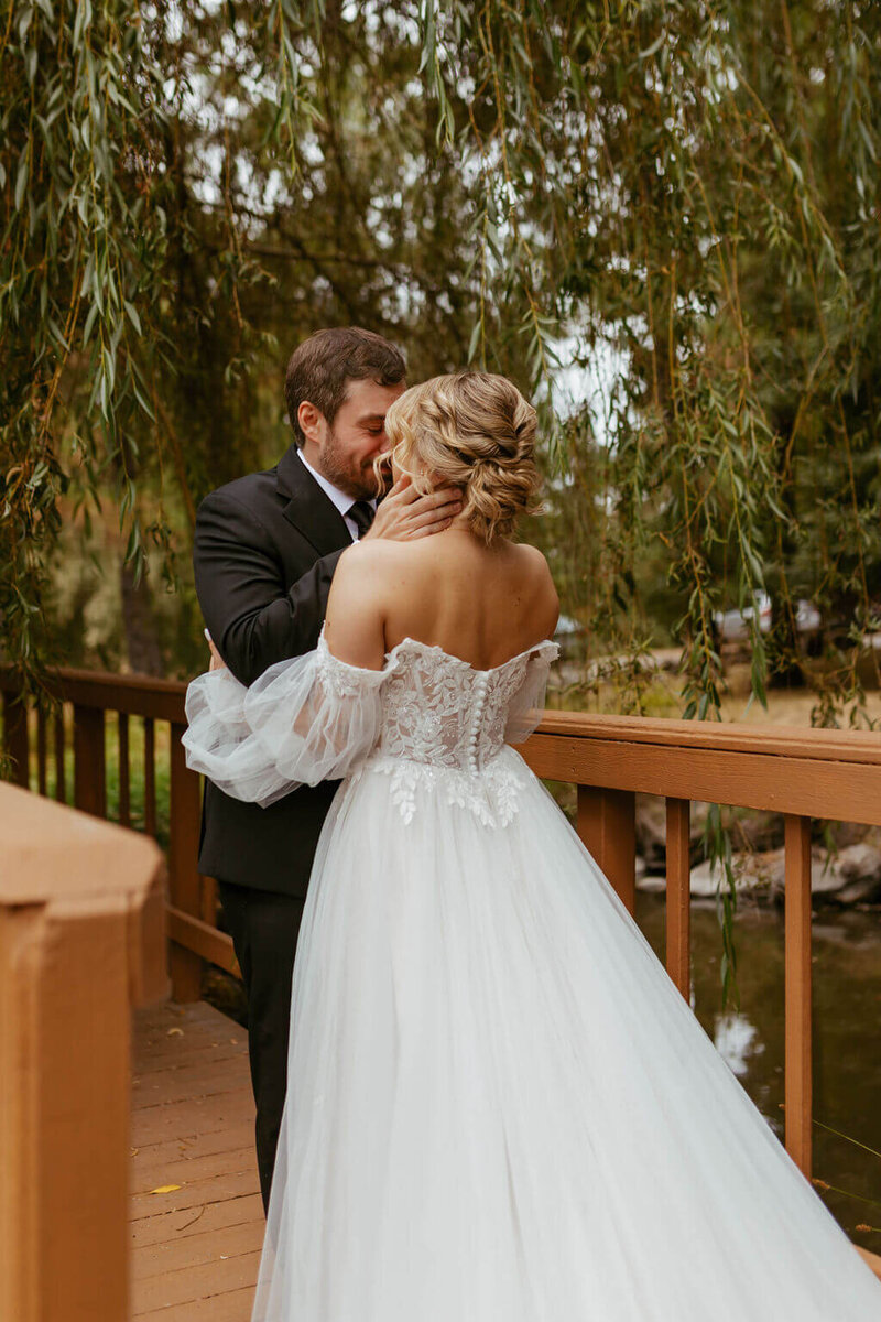 Jenny & Andy on their wedding day during their first look moment