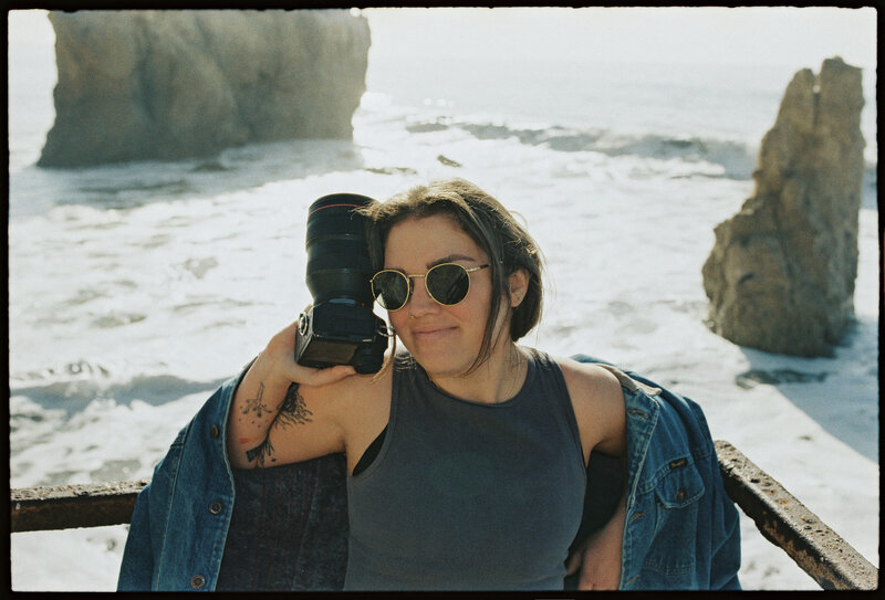 Tess Gearhart, Arizona-based wedding photographer, holding her camera | Editorial and documentary wedding photography