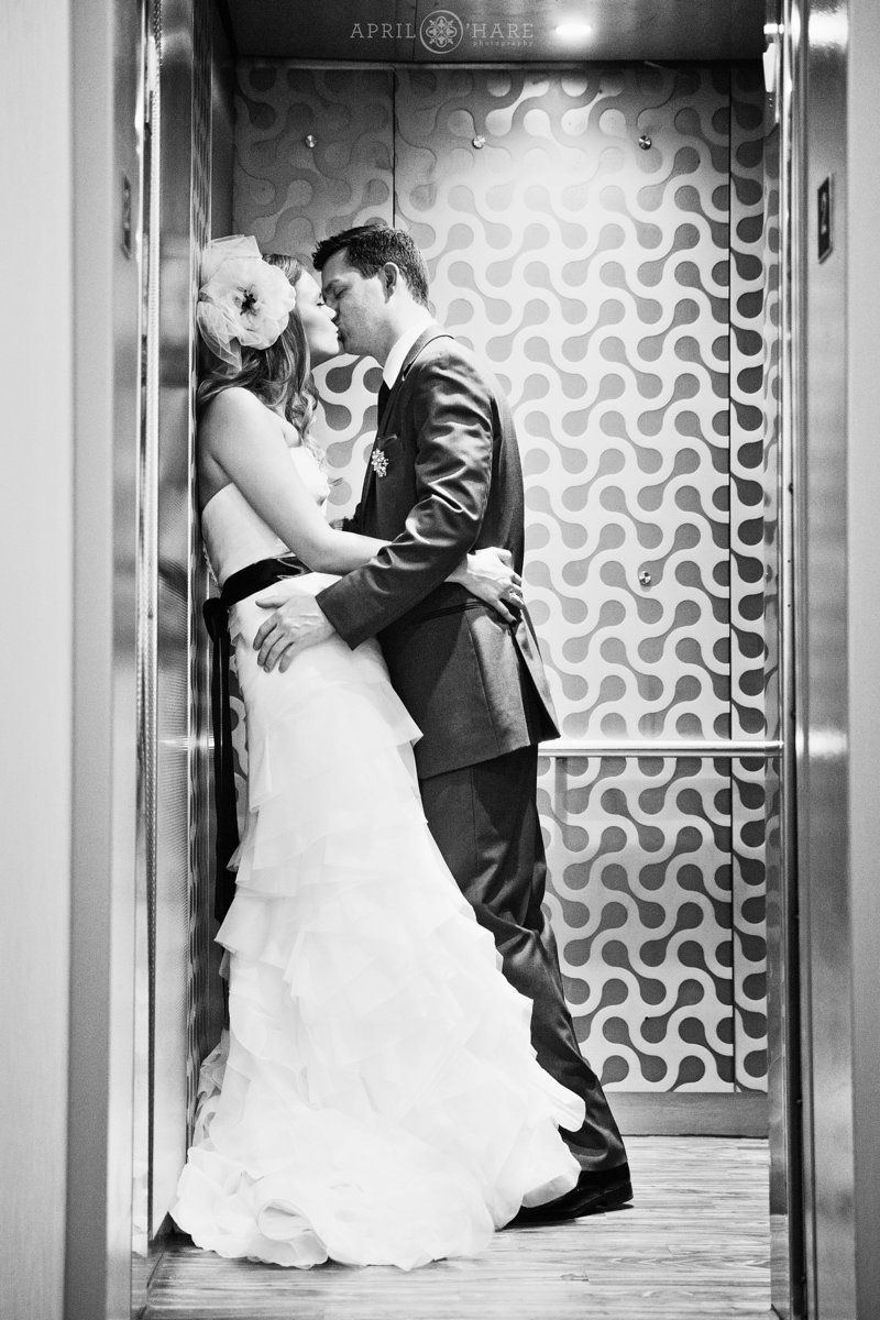Romantic photo of a couple kissing in the elevator at Curtis Hotel
