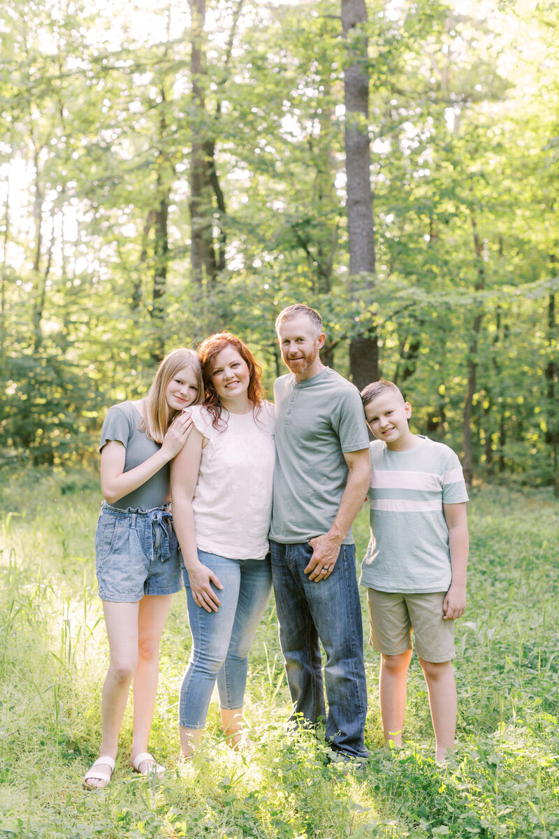 Family portrait in a wooded setting