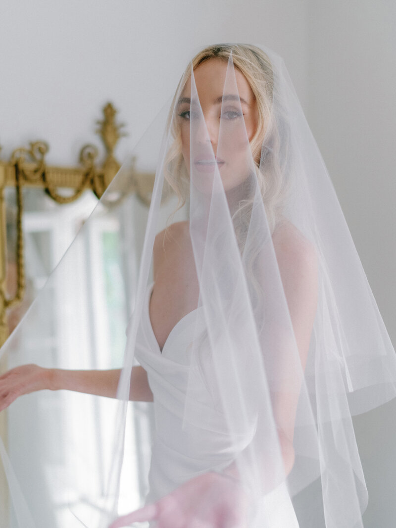 Editorial bridal portrait of a bride getting ready at The St. Regis Atlanta