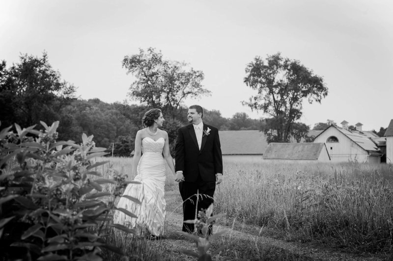 Bride and groom walk by farm, Brandywine Creek State Park, Wilmington, Delaware