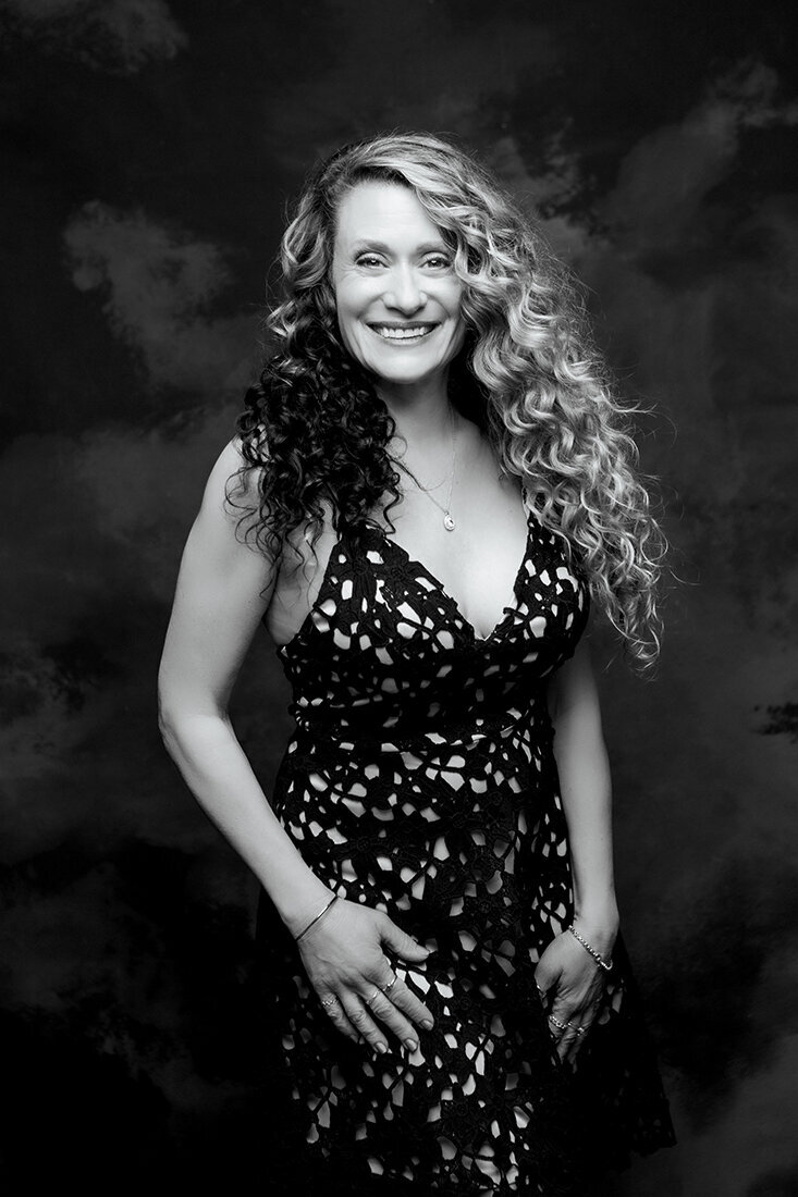 Stunning woman in floral dress takes headshot