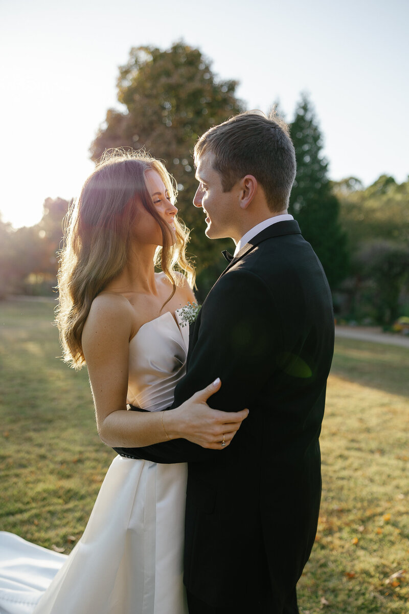 Bride and Groom share a kiss at the Botanical Garden of the Ozarks in North West Arkansas.