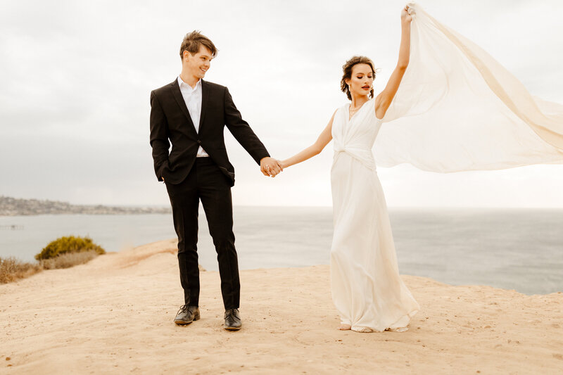 bride and groom at cliffside elopement in San Diego