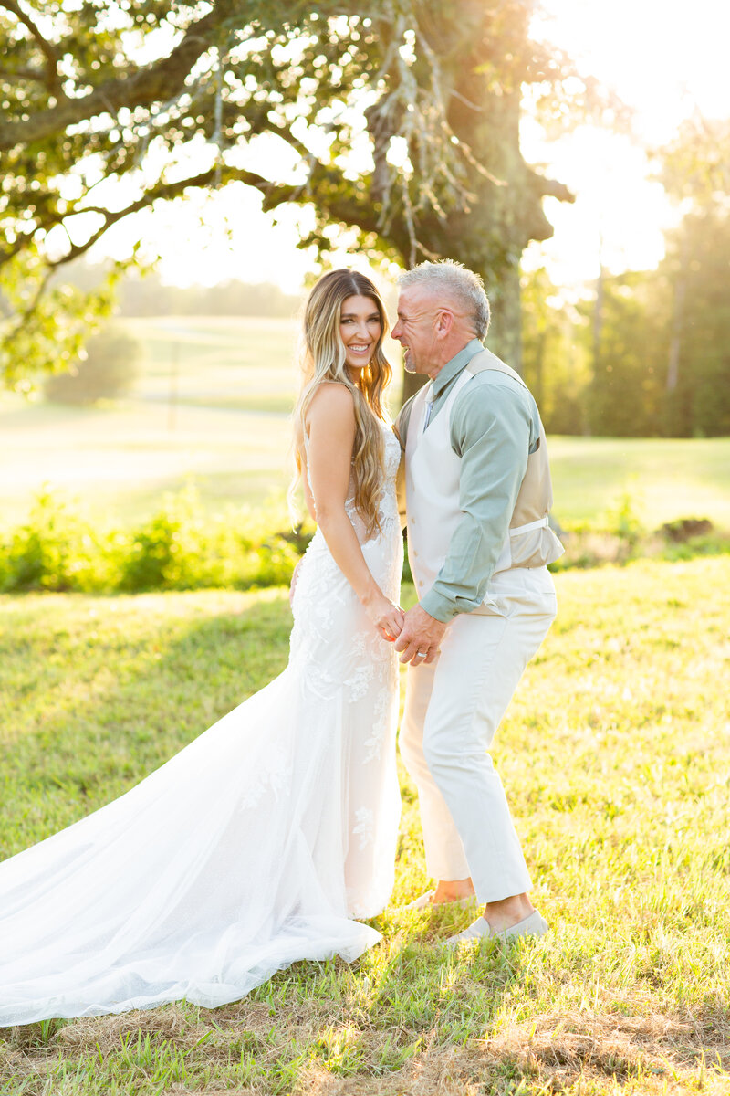 bride smiling in her wedding dress and veil