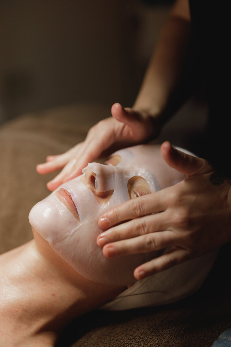 Karli giving client a facial massage