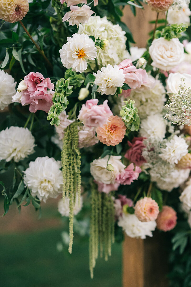 Cross altar floral arrangement designed by Abby Grace Florals at Anderson SC wedding 