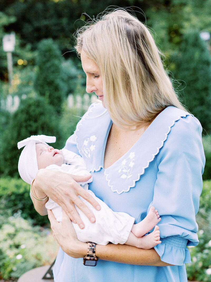 A mother holding a baby during a family photography session in Richmond by Katie Stansfield Photography.