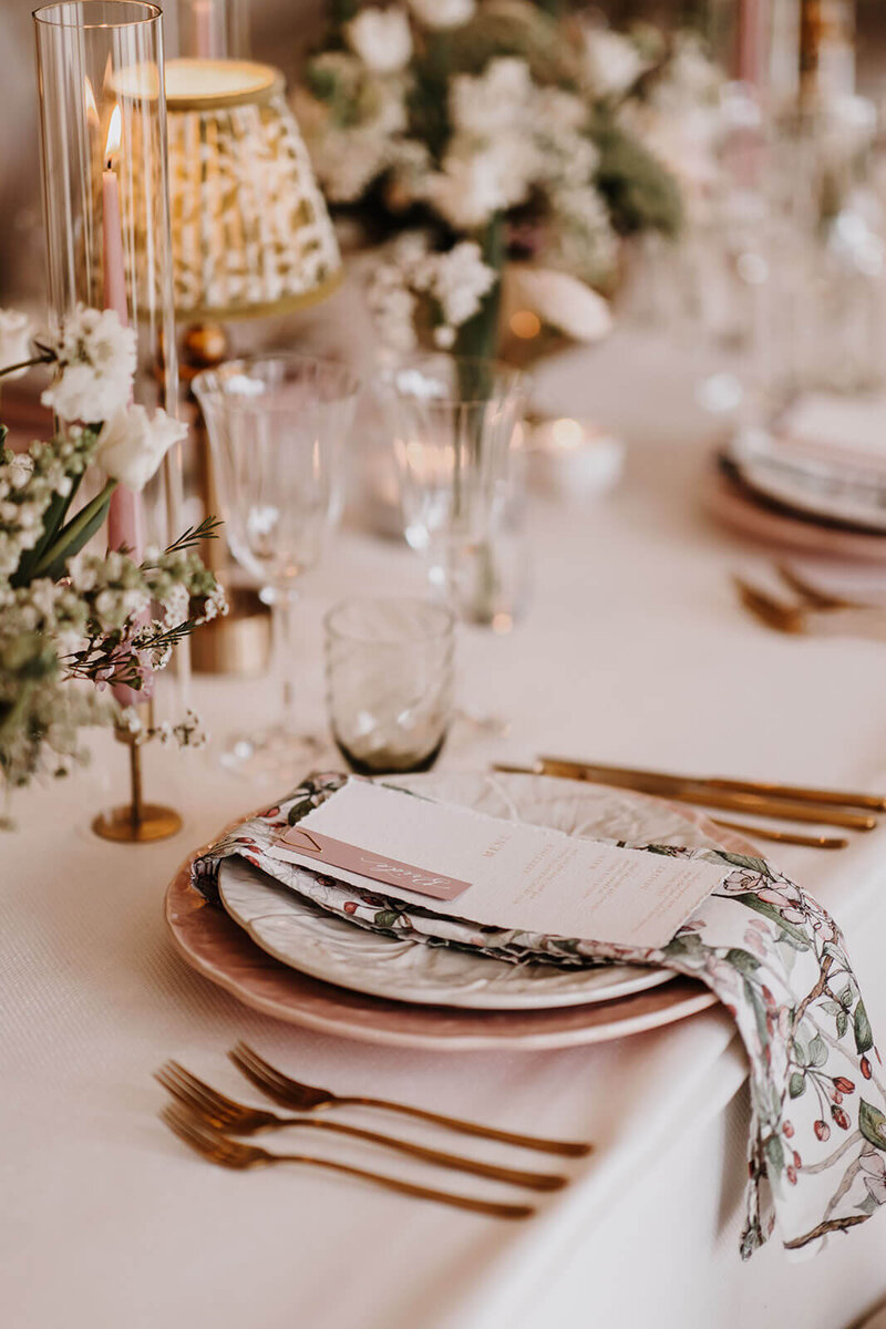 Elegant close-up of a wedding reception place setting at Caswell House