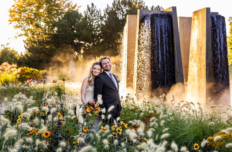 Wedding Couple at the Fountain Beds Gardens near the Concrete Fountain at Sunset at Denber Botanic Gardens