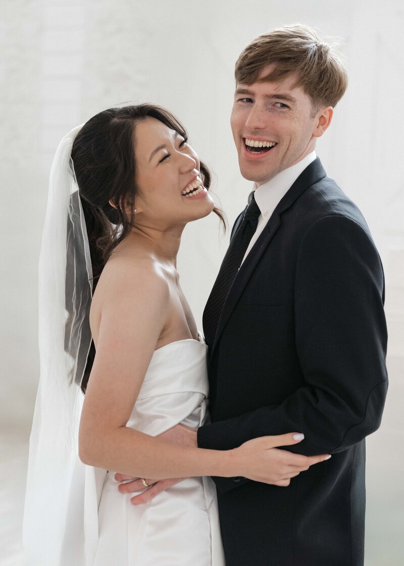 Bride and groom smile after wedding ceremony in San Antonio, Texas.