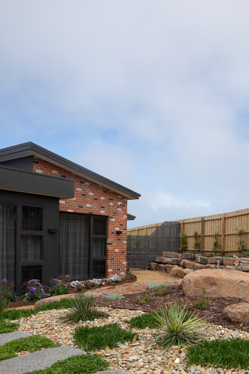 Garden design for new construction with rock work and paving