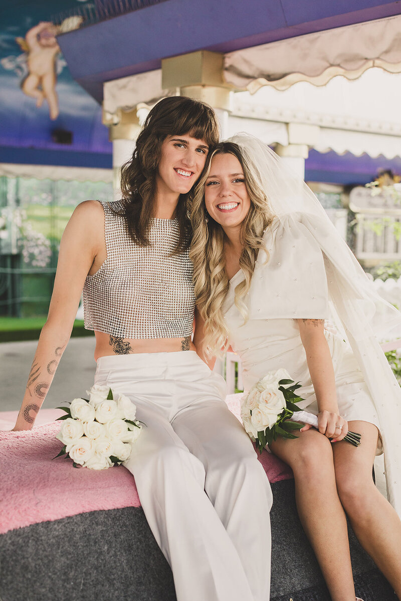 LGBTQ+ couple cuddle up for photos after their las vegas elopement
