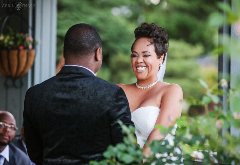 Bride smiles on her wedding day at  the water garden gazebo at Denver Botanic Gardens