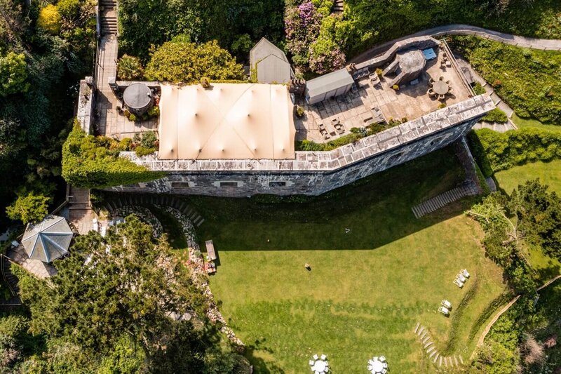 An aerial photo of Polhawn Fort showing the stretch marquee on the terrace