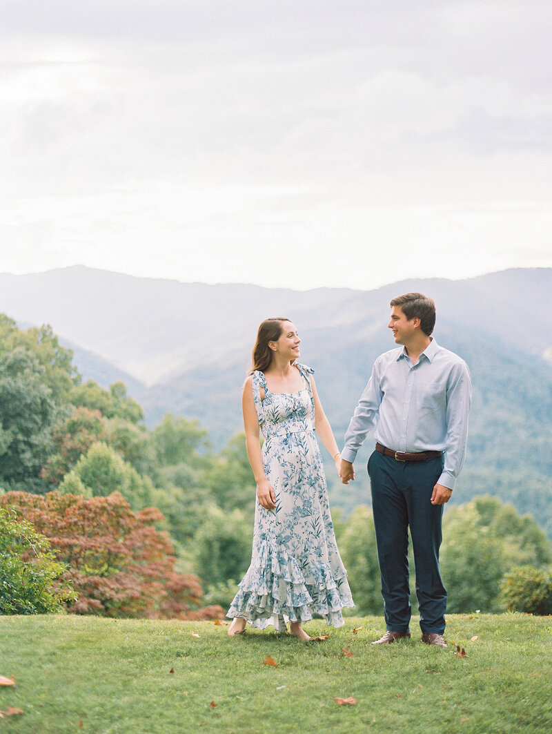 during a quiet moment before their wedding an asheville wedding photographer captures them in the mountains of byrson city
