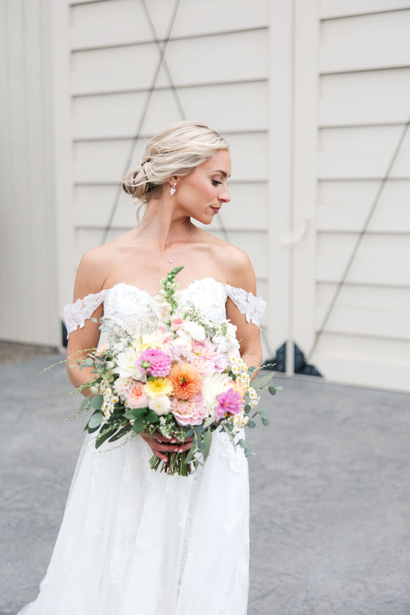 Photo of bride looking off to the side at Tuck'd Inn Farm in Cooksburgh PA