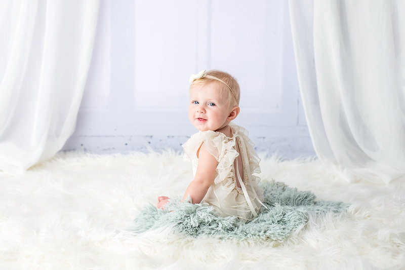 Baby-girl-on-rug