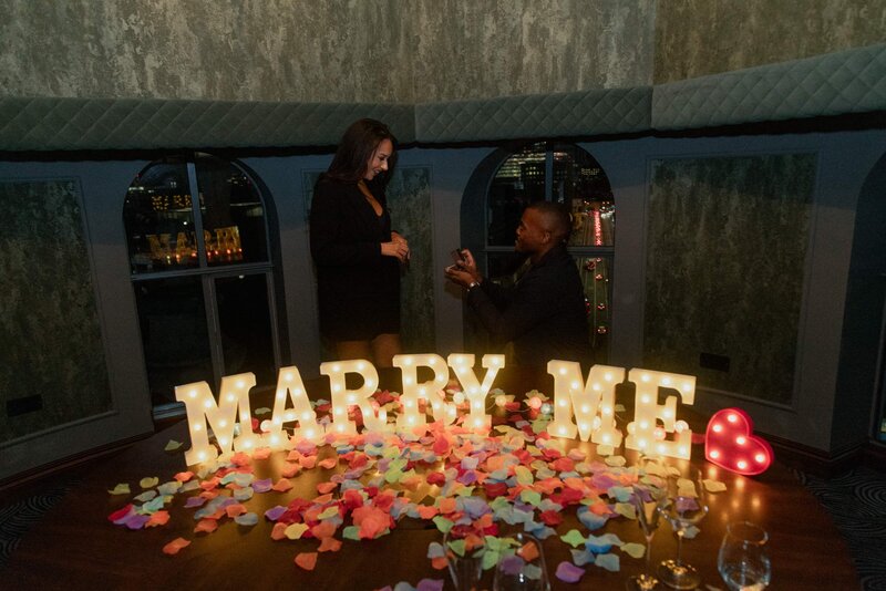 She said 'yes' at an indoor surprise proposal rooftop in London with St Paul's Cathedral in the background