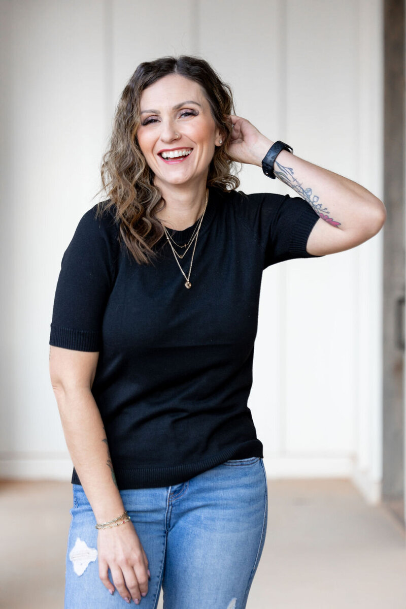 woman in black smiling at camera