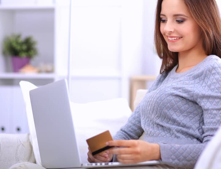 Author using laptop for inexpensive book publishing online