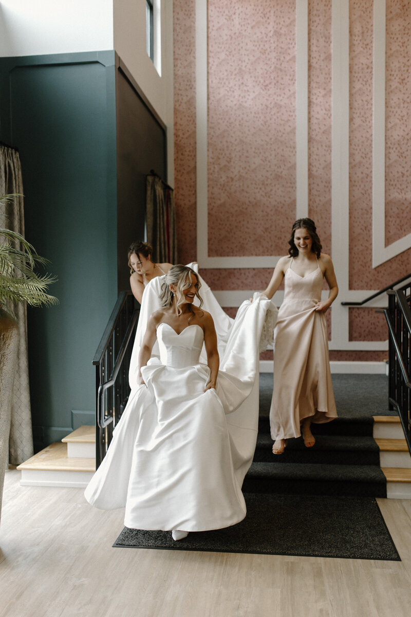 A BRIDE WALKING DOWN THE STAIRS