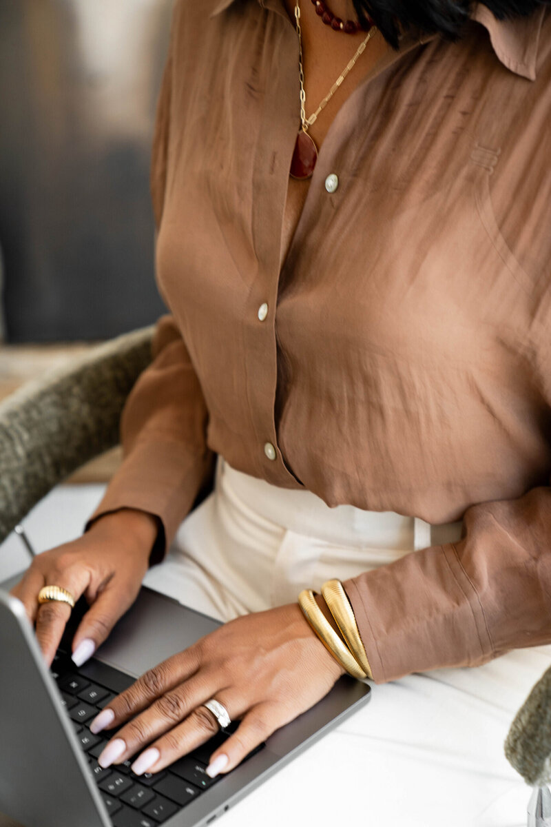 closeup on a woman's on a computer keyboard