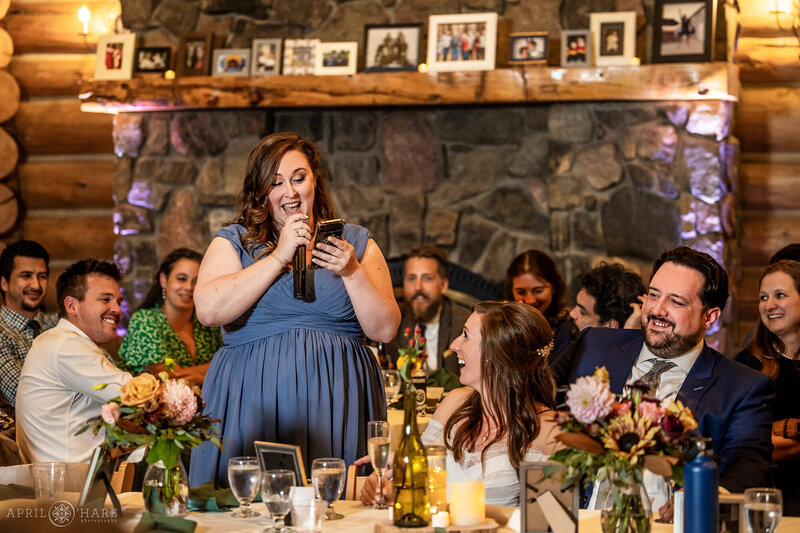 Toasts inside of the Evergreen Lake House set up with long table