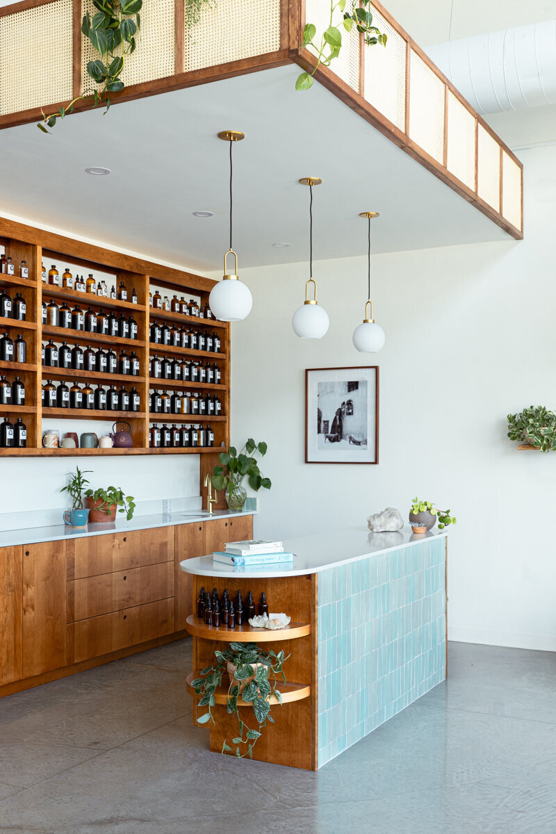 Austin Retail Interior Design with custom cabinets and oval tiled island