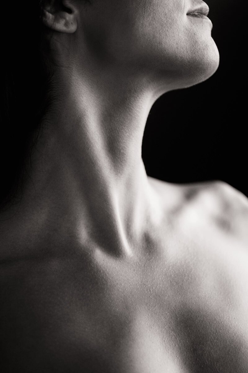 Artistic boudoir photo of a woman's neck