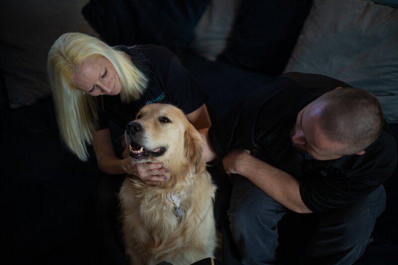 Drew and AJ, co-founders of Nature's Way Pet Aquamation, with their dog, symbolizing their dedication to compassionate pet afterlife care in Lansing, Michigan.