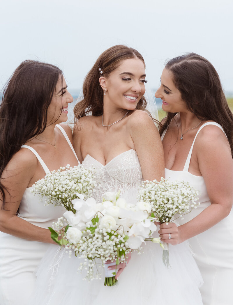 maid of honors with the bride on wedding day photo