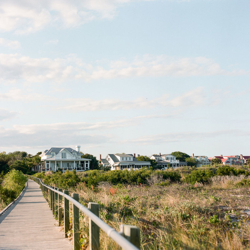 A row of beach houses and a boardwalk on Sullivan’s Island beach, SC